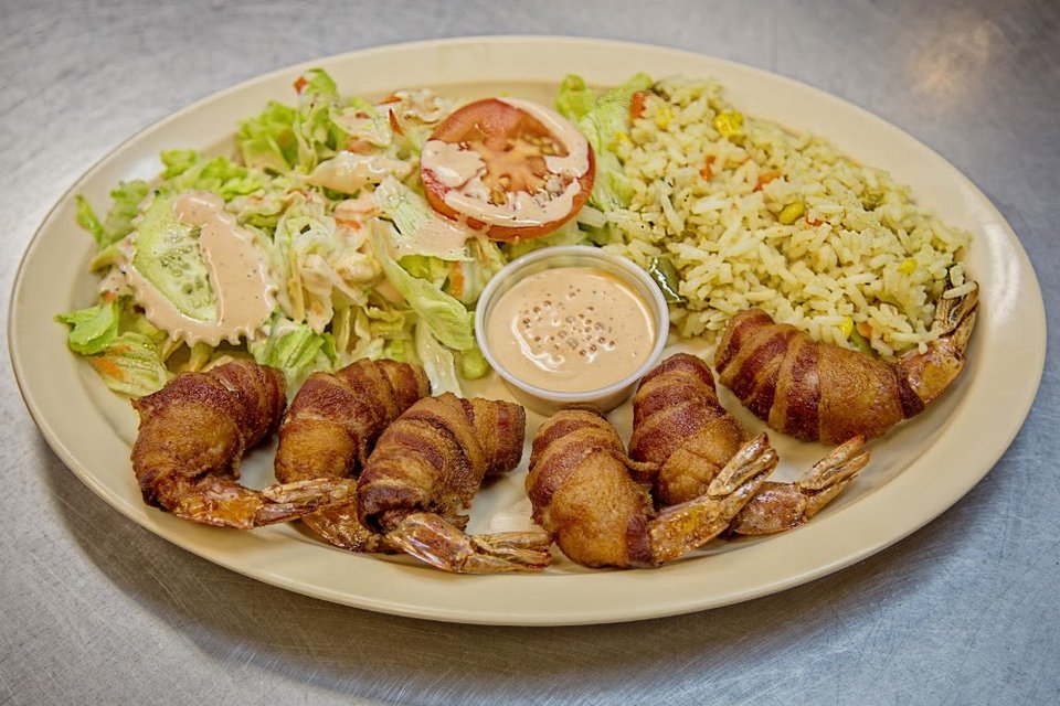Restaurant menu highlighting mariscos and small plates.
